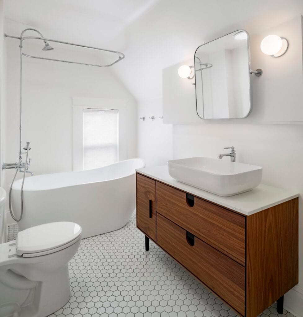 Modern bathroom renovation with stylish vanity and bathtub, quality construction.