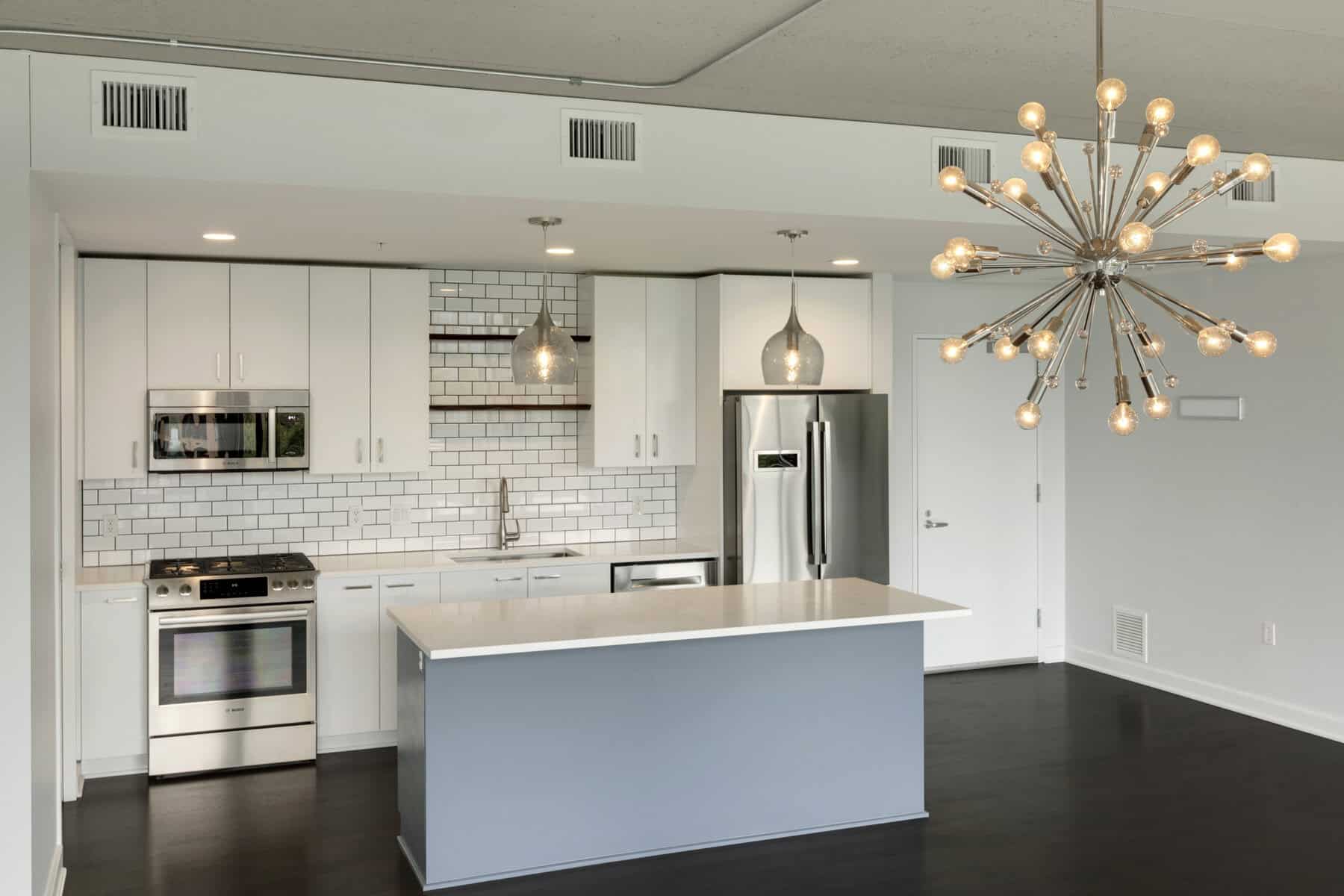 Contemporary White Kitchen with Sputnik Light Minneapolis Condo