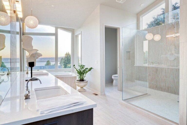 Bathroom remodel with glass shower by Prima Construction