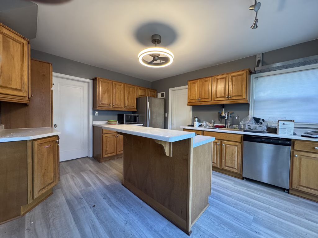 Dated kitchen with wooden cabinets (Before Photo)