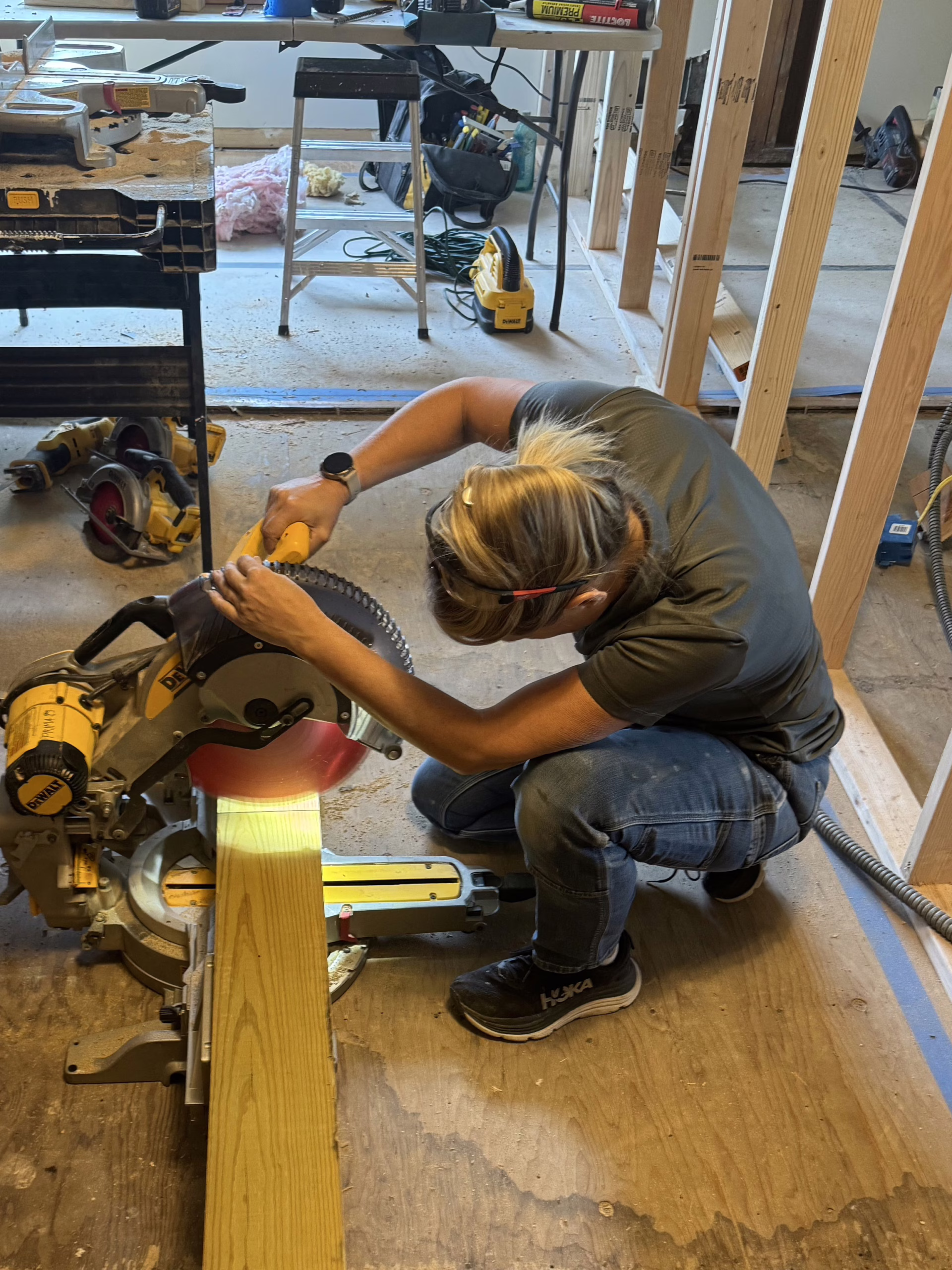 Kim Studham (Owner Prima Construction) cutting a 6x6" post to install under custom LVL Header.